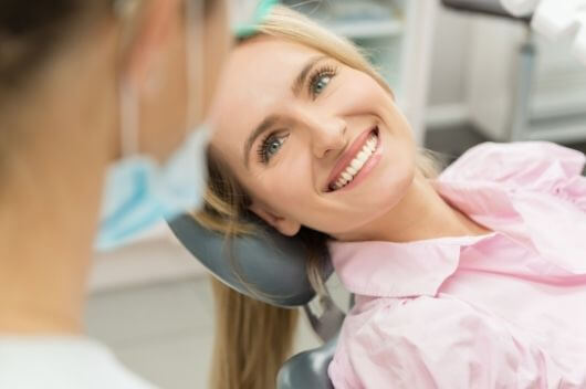 Woman laying down in dental chair in Pontefract getting composite bonding