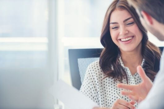 Woman smiling at dental implants consultation at Pontefract