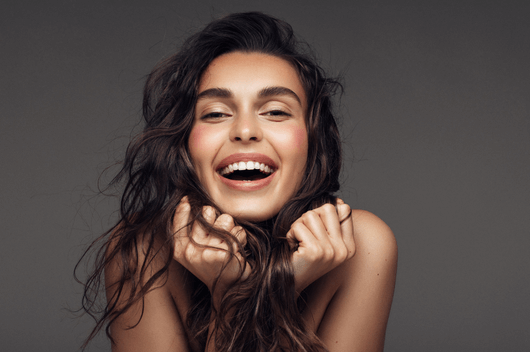 Woman With Composite Bonding Smiling At Camera