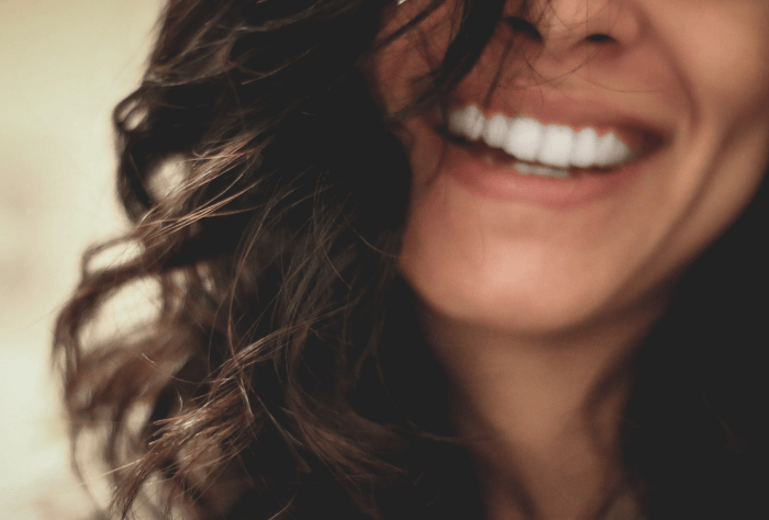 Woman with straight teeth smiling