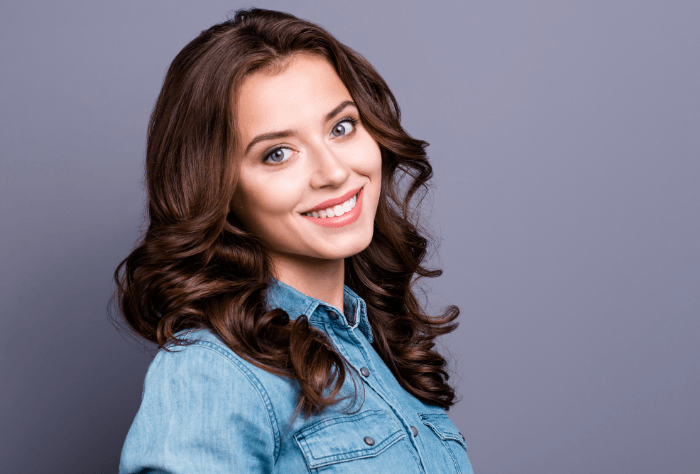 Woman smiling, wearing invisible braces