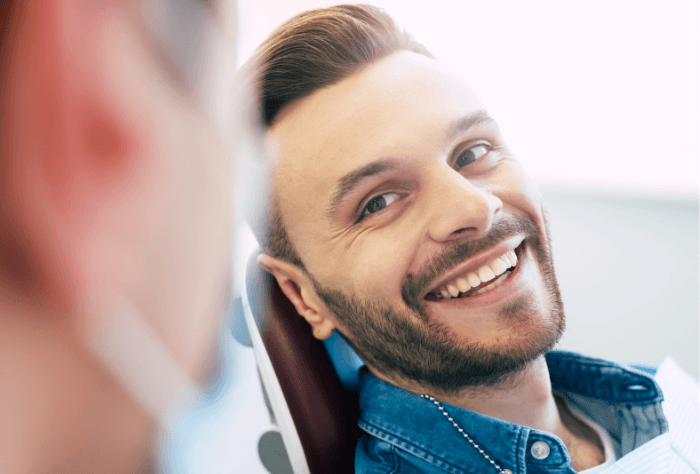 Man smiling with dental implants