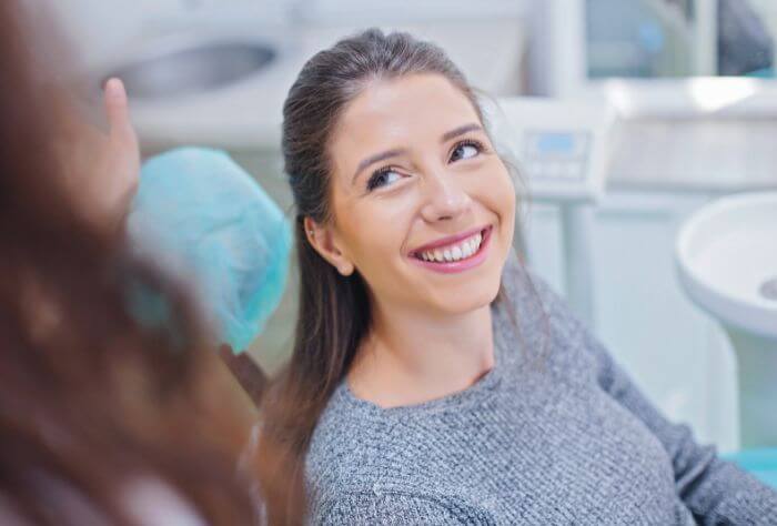 woman sat at private dental consulation