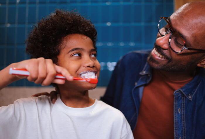 Child brushing teeth